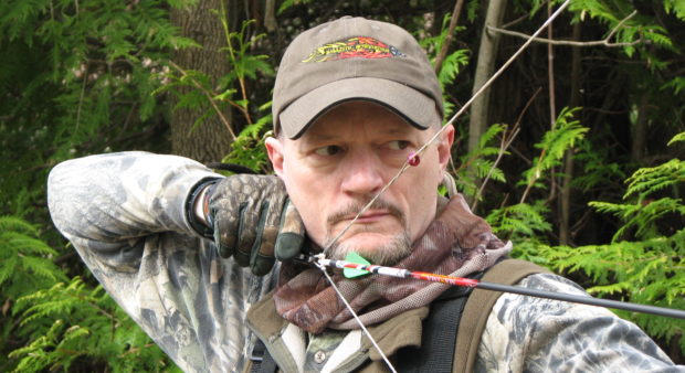 new compound - man holding a compound bow
