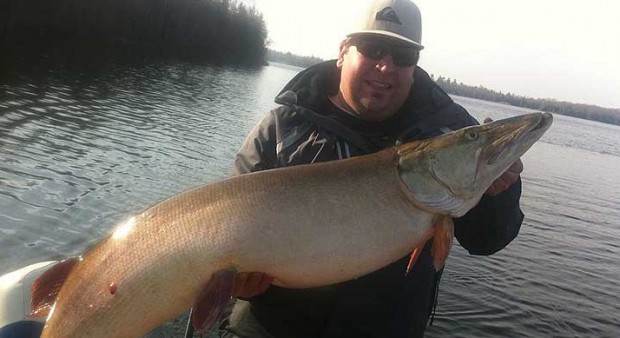 Mitch Dane - a man holding a muskie