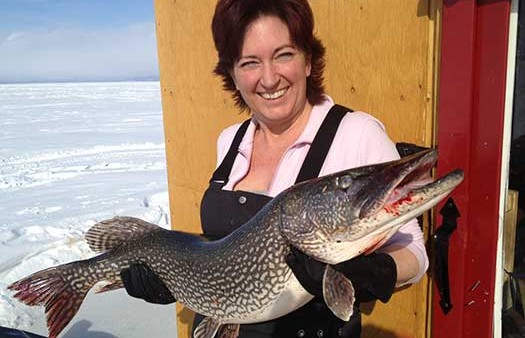 Michelle Paolini - a woman holding a large pike