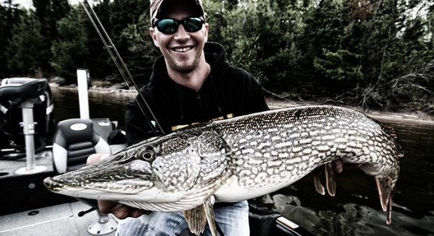 best water - man holding a monster pike