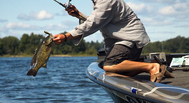 man catching a bass 