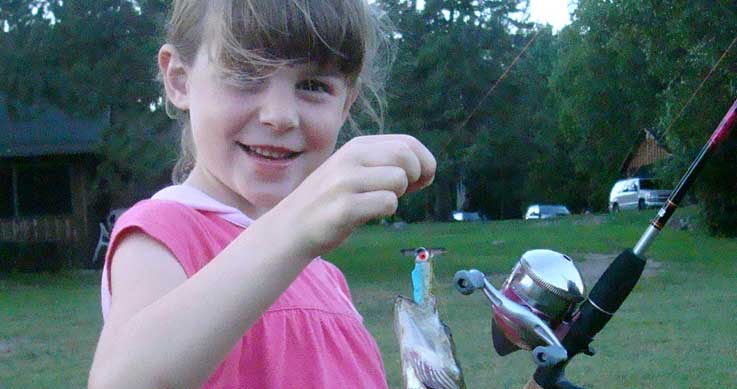 Cloée - girl holding a fish