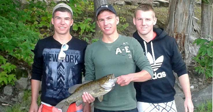 Matt - 3 guys holding a fish